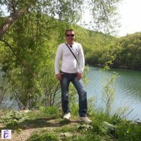 николай